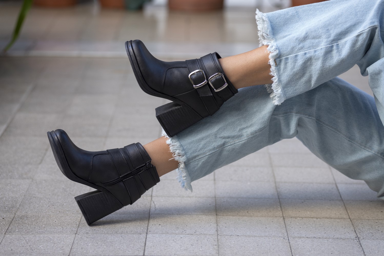 closeup shot of a woman wearing boots outdoors