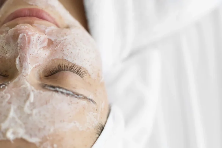 close up woman using face cream