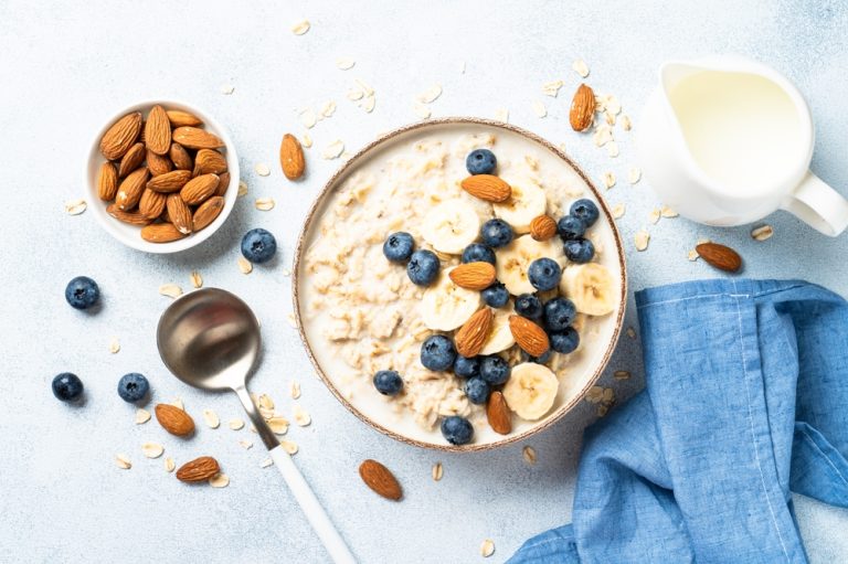 healthy,breakfast.,oatmeal,porridge,with,berries,,bananas,and,almonds.,top