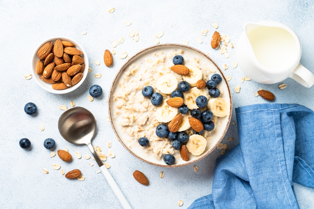 healthy,breakfast.,oatmeal,porridge,with,berries,,bananas,and,almonds.,top
